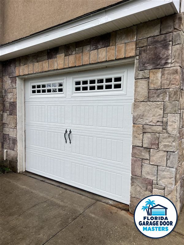 New carriage-style garage door installed by Florida Garage Door Masters