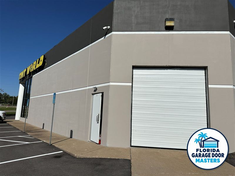 Commercial building with a white overhead service door
