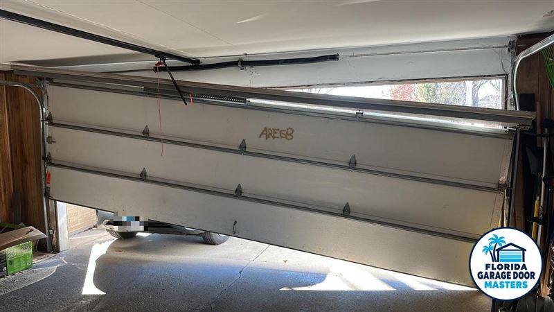 Crooked garage door that came off its track before repair